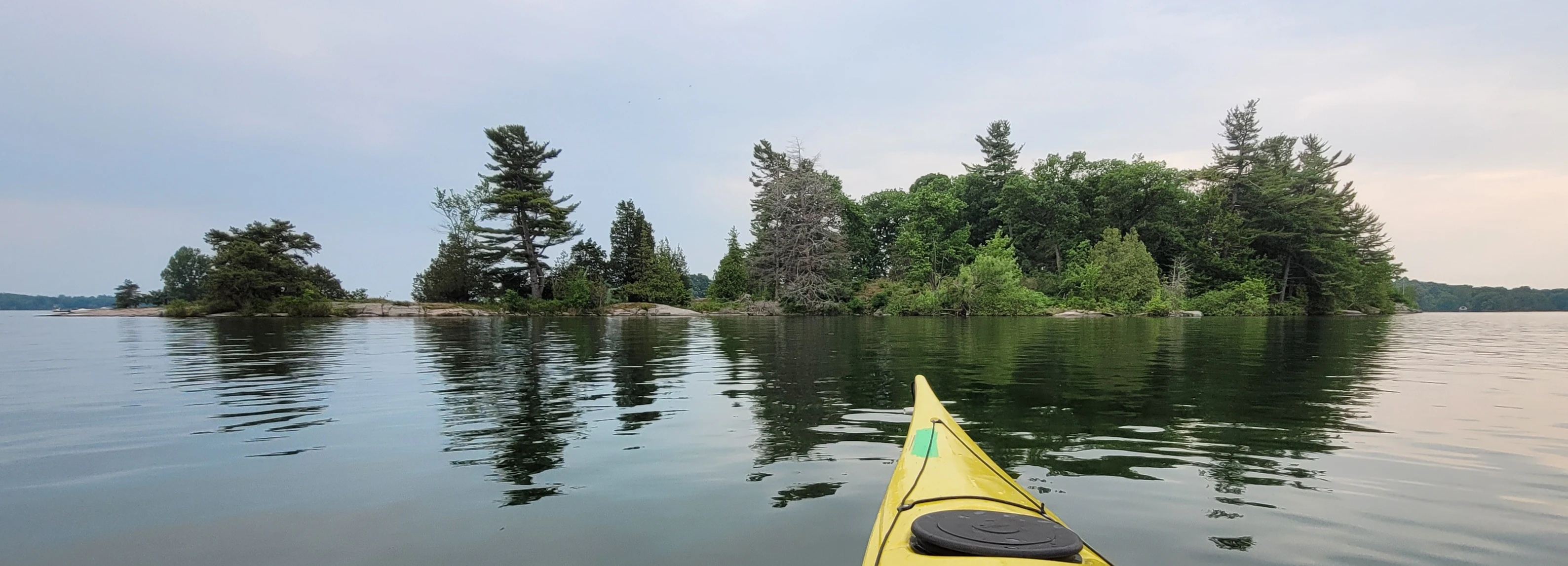 Islands in the distance viewed from a kayak in the Thousand Islands in Ontario Canada